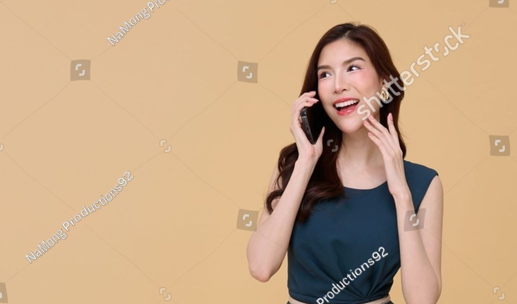 Woman smiling while calling the clinic