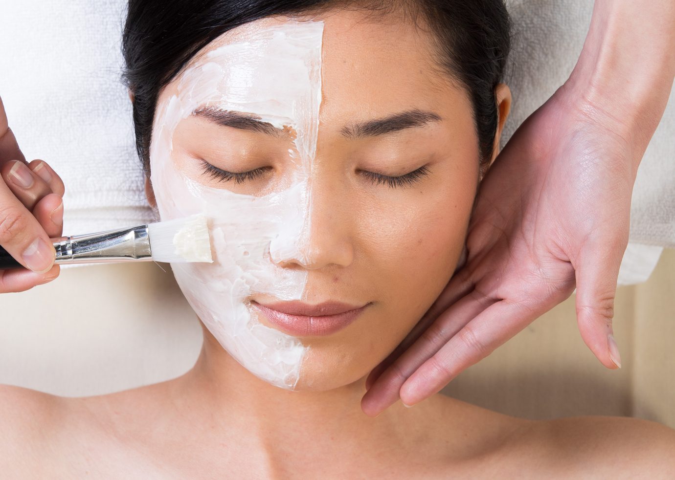 Facial mask being applied during a skin treatment