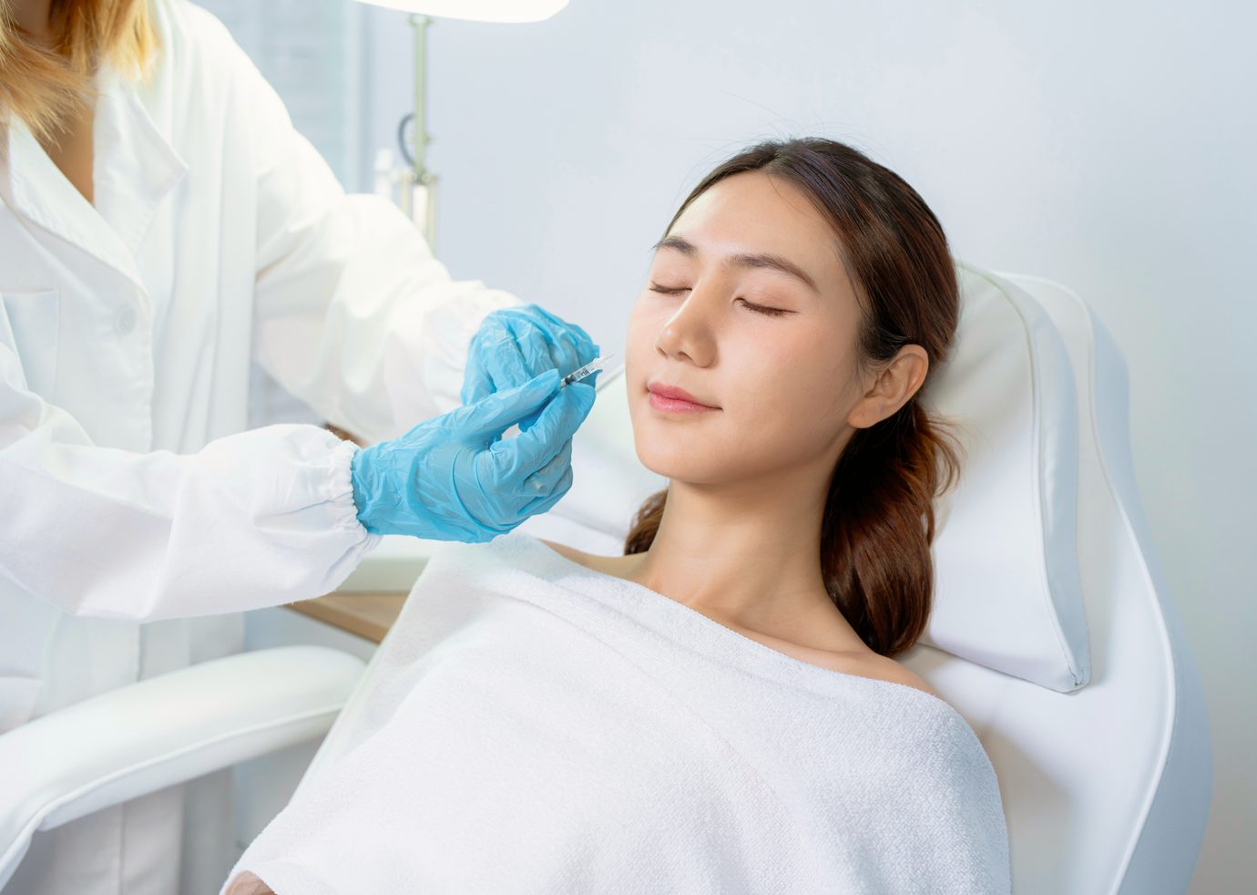 Patient smiling during an aesthetic consultation